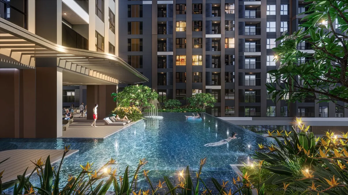 Hồ bơi chân mây về đêm giữa 2 tháp căn hộ A&T Sky Garden với mảng xanh và khu thư giãn ven hồ — căn hộ A&T Sky Garden