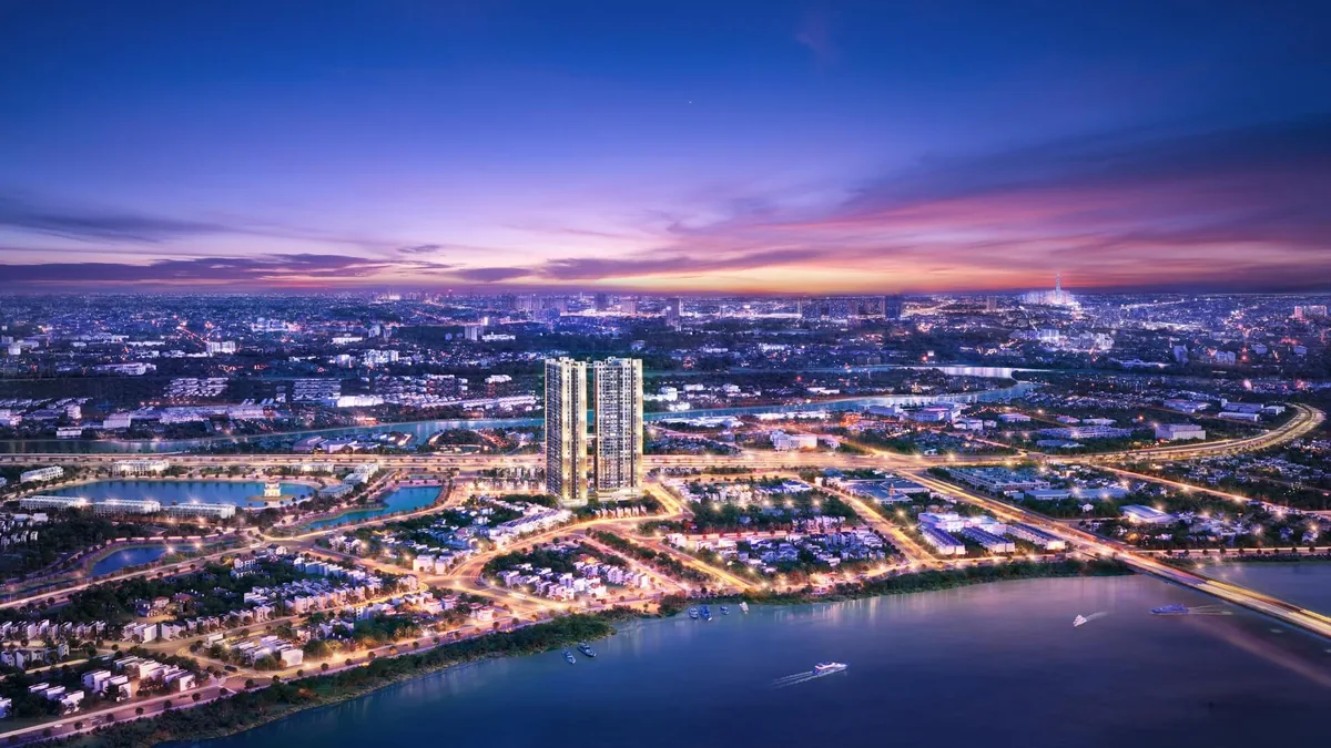 Phối cảnh A&T Sky Garden về đêm bên sông Sài Gòn, 2 tháp căn hộ sáng đèn giữa toàn cảnh đô thị Thuận An, Lái Thiêu — căn hộ A&T Sky Garden